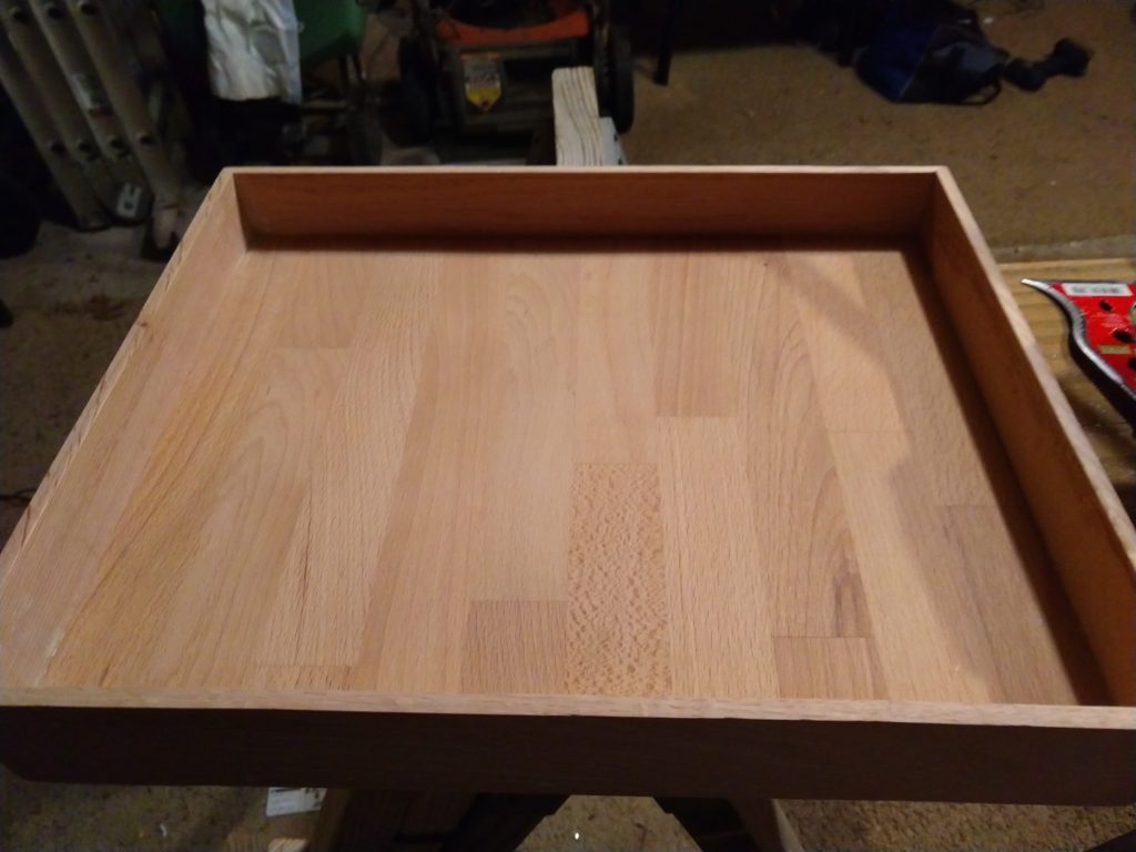 Cabinet oak frames a section of unused oak shelving to make a box frame for the end tables.